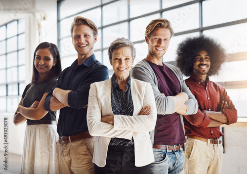 The team you can always depend on. Portrait of a team of happy designers posing confidently in their modern office. photo