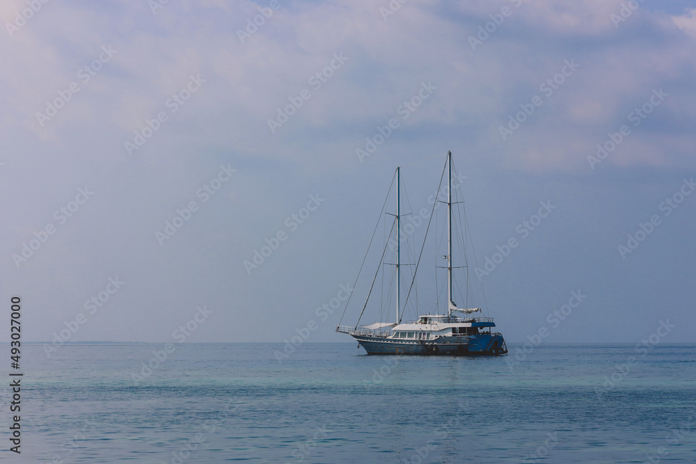 Maafushi, Maldives - June 25, 2021:  Private Boat in the Indian Ocean with the Alcohol Drinks trading near Maafushi Island