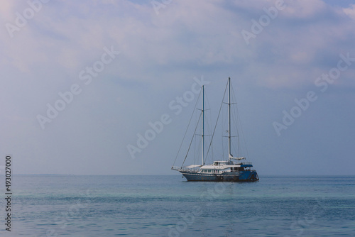 Maafushi, Maldives - June 25, 2021: Private Boat in the Indian Ocean with the Alcohol Drinks trading near Maafushi Island