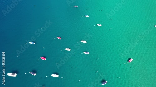 Fly Over Anchored Sailboats In A Cove On Lake Tahoe In California USA. Aerial Drone photo