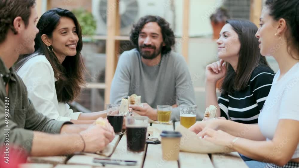 Video of happy multiethnic business team eating while having fun at cafeteria in lunch break in a coworking place. Video of happy multiethnic business team eating while having fun at cafeteria in lunch break in a coworking place.