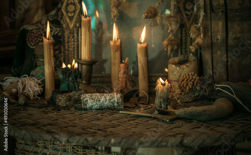 Candle burns on the altar, powerful magic among candles, pagan or wicca concept