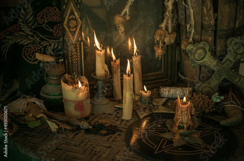 Candle burns on the altar, powerful magic among candles, pagan or wicca concept
