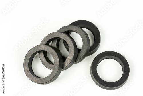 A rubber ring - a gasket, an oil seal for repairing a car brake caliper on a plane. Set of spare parts for car brake repair. Details on white background, copy space available.