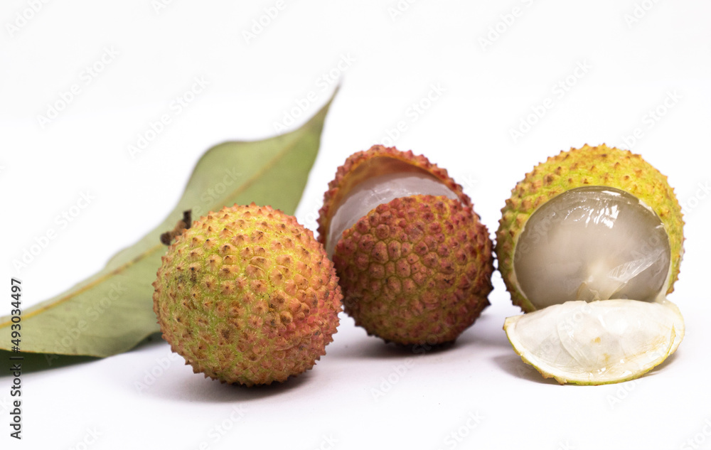 Whole and open lychee isolated on white background Whole and open lychee isolated on white background