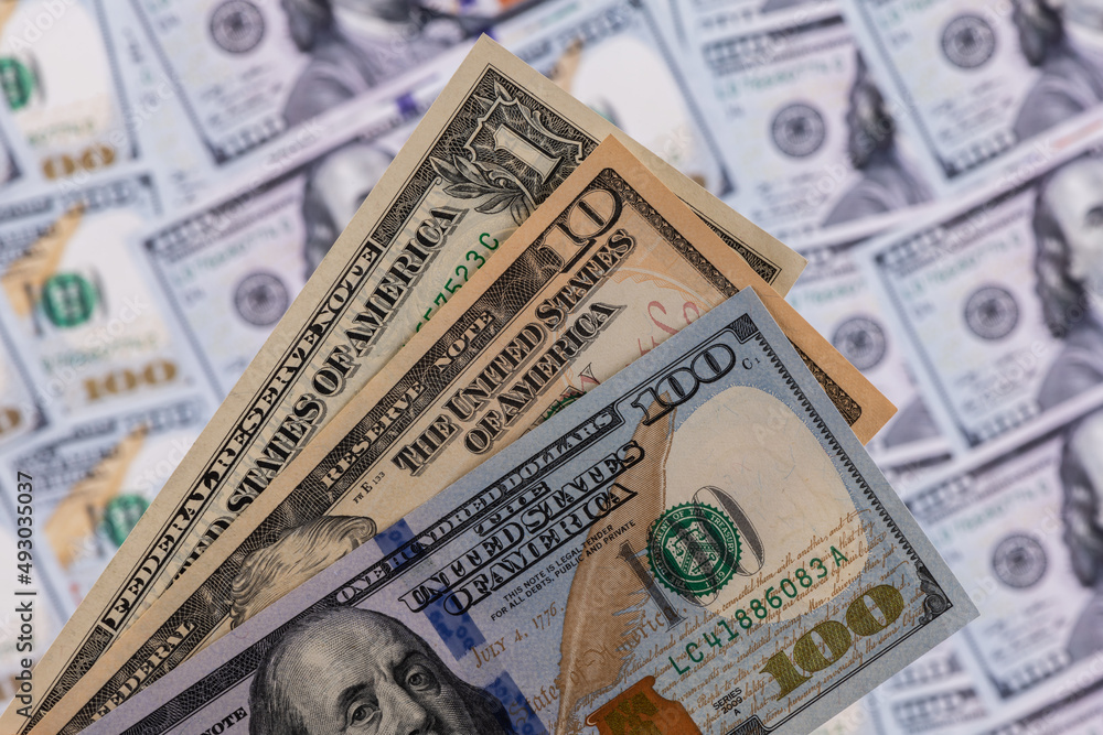 American banknotes in denominations of 1, 10 and 100 dollars American banknotes in denominations of 1, 10 and 100 dollars