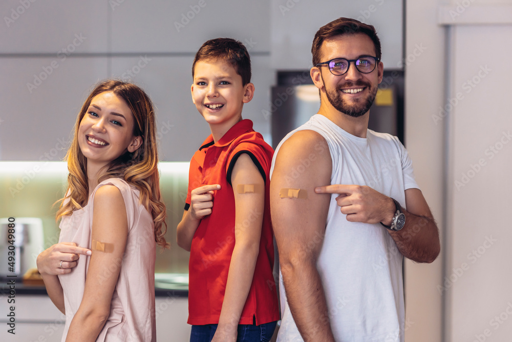 Coronavirus Vaccination. Vaccinated Family Of Three With Adhesive Bandage On Arms Posing At Home After Getting Covid-19 Vaccine - obrazy, fototapety, plakaty 