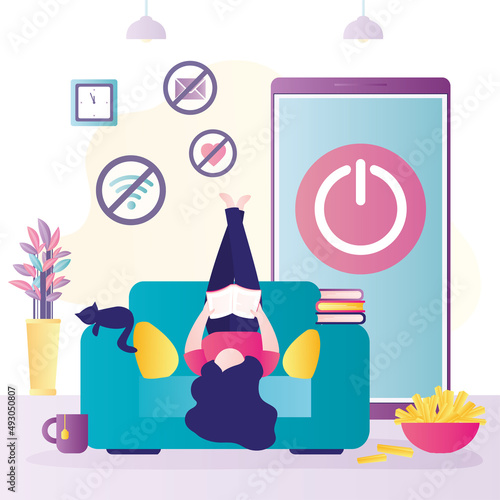 Young woman lies on armchair upside down. Refusal of gadgets. No internet addiction. Digital detox. Mobile phone with off button. Girl is reading book or textbook.