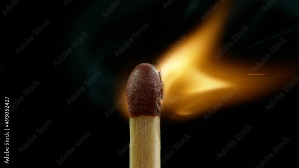 Super Slow Motion Macro Shot of Igniting Match against Black Background at 1000fps. Super Slow Motion Macro Shot of Igniting Match against Black Background at 1000fps.