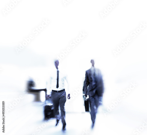Rushing through the daily grind. Blurred shot of a businesspeople commuting.