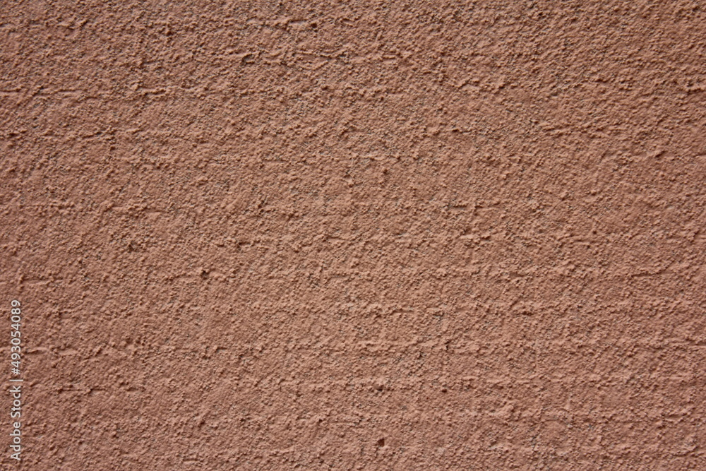 Pink dry plastered concrete wall close-up texture of industrial background Pink dry plastered concrete wall close-up texture of industrial background