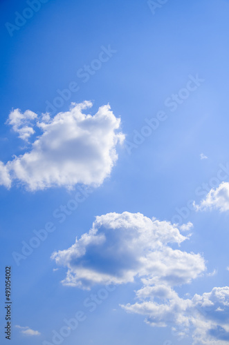 Blue sky with white cumulus clouds