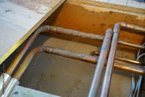 Close up of under floor copper pipes in a house     