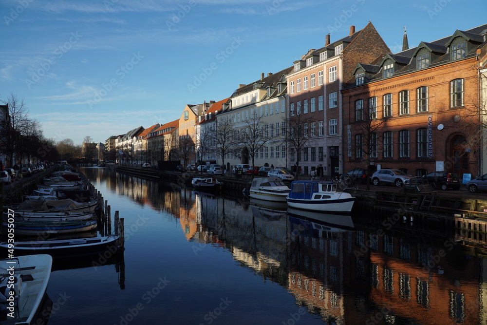coloгrful buildings along the canal with boats in Copenhagen Denmark