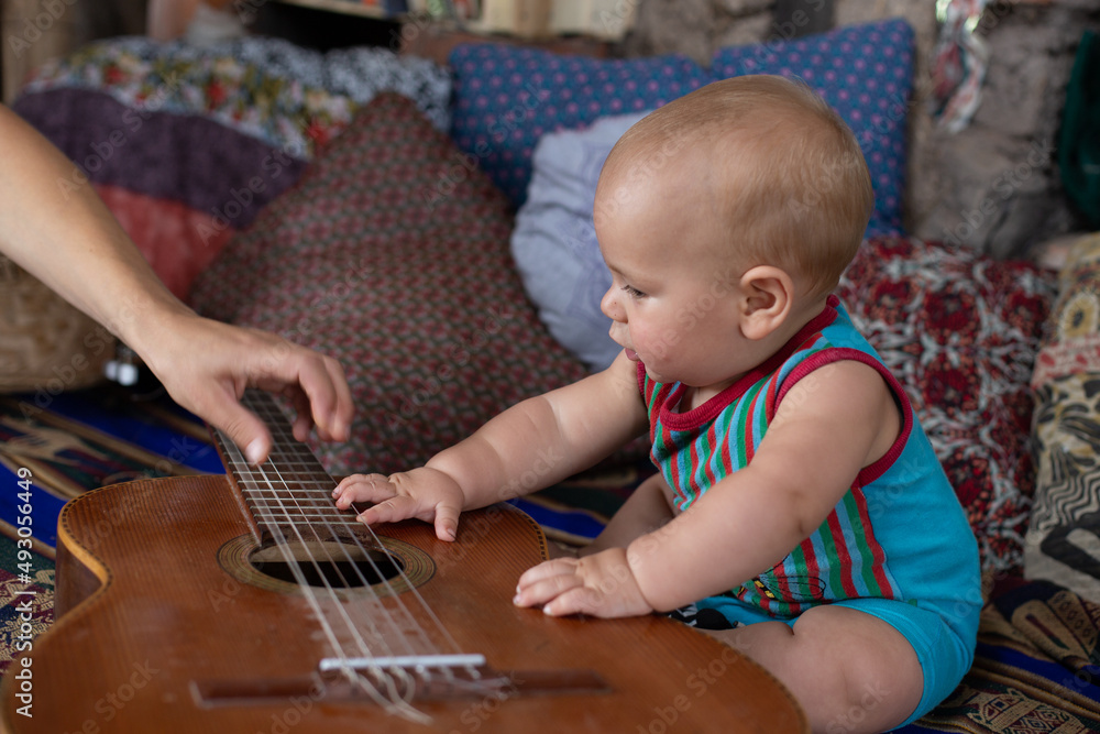 Excited boy playing with a musical instrument Excited boy playing with a musical instrument