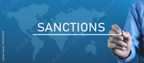 Man writes Sanction word in screen.