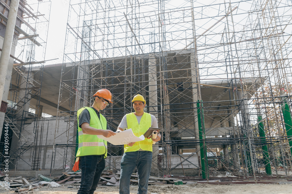 Confident team of architect working together in building construction site. They discussing about new startup project. Architect discuss with engineer about project . Architectural concept. Confident team of architect working together in building construction site. They discussing about new startup project. Architect discuss with engineer about project . Architectural concept.