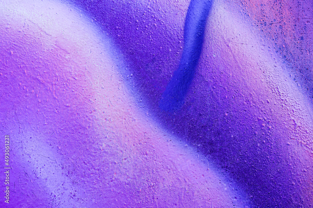 Obraz premium Beautiful bright colorful street art graffiti background. Abstract creative spray drawing fashion colors on the walls of the city. Urban Culture gradient texture, copyspace backdrop