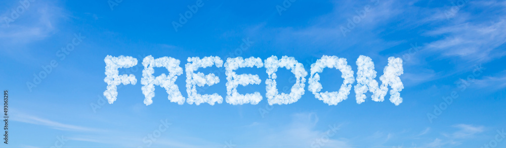 Freedom word made of clouds on blue sky background Freedom word made of clouds on blue sky background