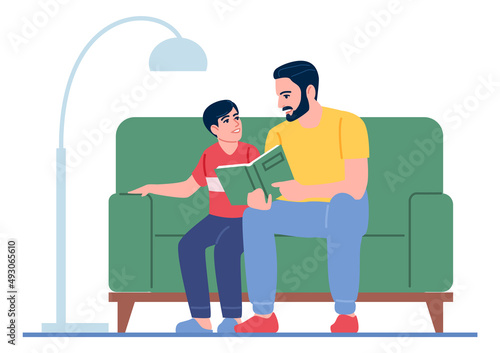 Father and son reading book together. Happy parenting concept