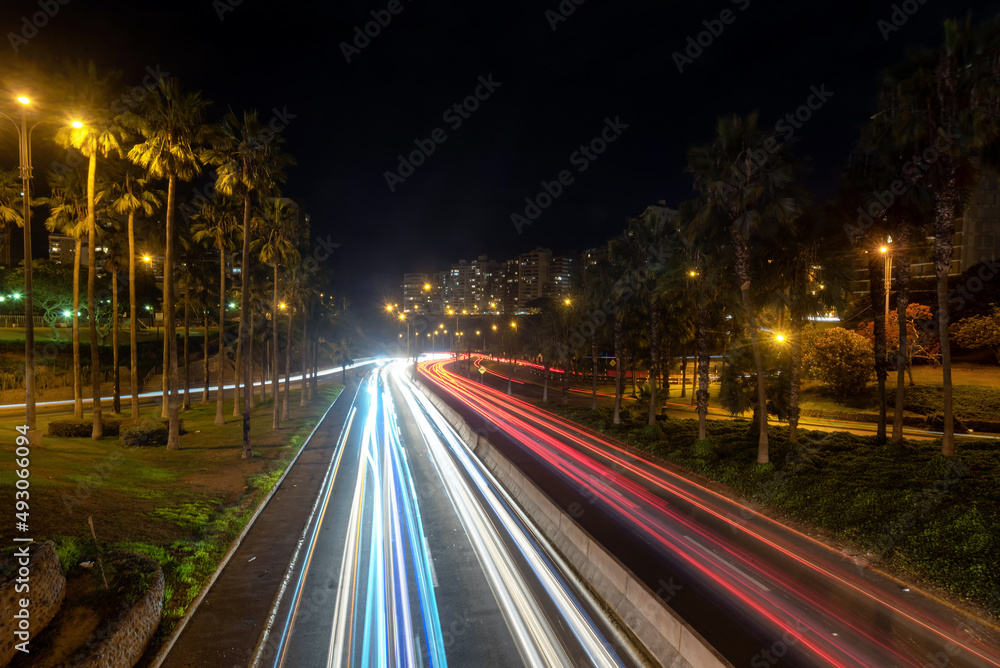 Long exposure light trails over a Lima, Peru highway between the Barranco and the tourist Miraflores districts