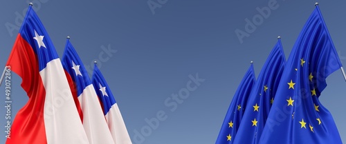 Photography Three flags of European Union and Chile on flagpoles on sides