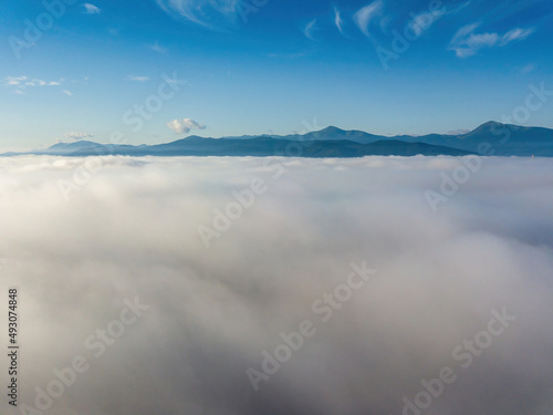 Morning fog in the Ukrainian Carpathians. Aerial drone view.