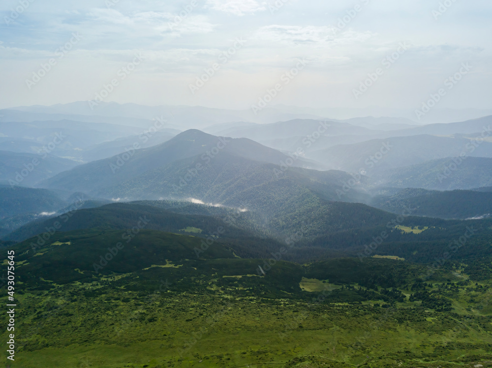 High mountains of the Ukrainian Carpathians in cloudy weather. Aerial drone view. High mountains of the Ukrainian Carpathians in cloudy weather. Aerial drone view.