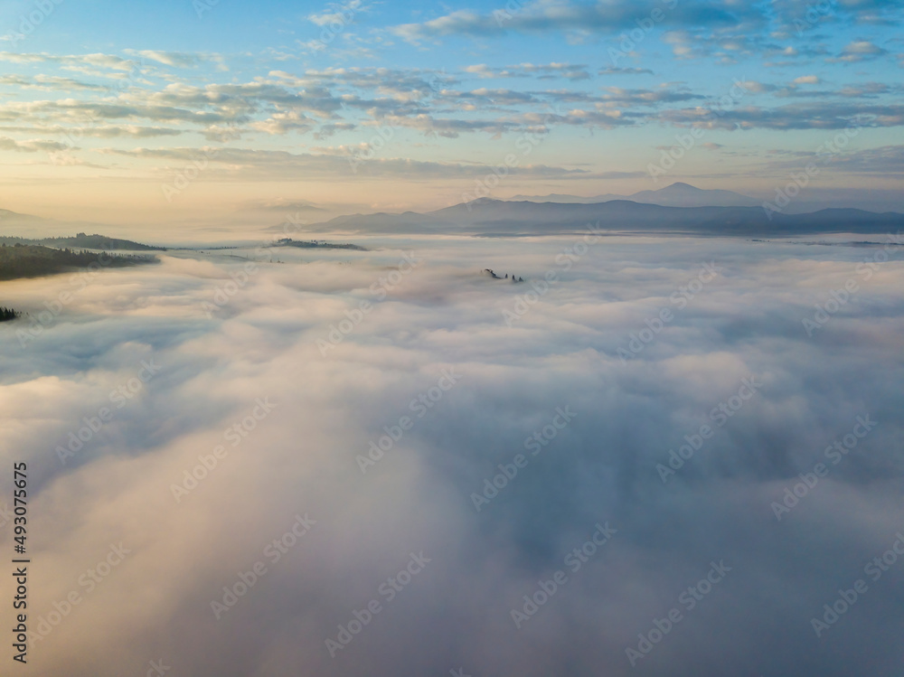 Morning fog in the Ukrainian Carpathians. Aerial drone view.