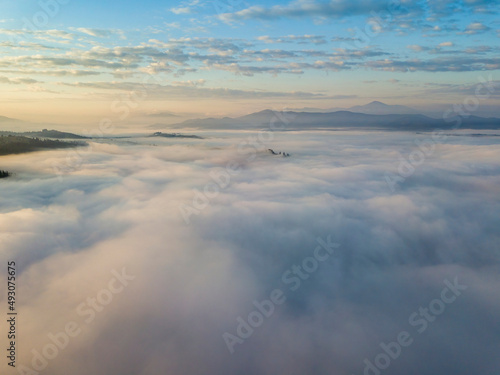 Morning fog in the Ukrainian Carpathians. Aerial drone view.