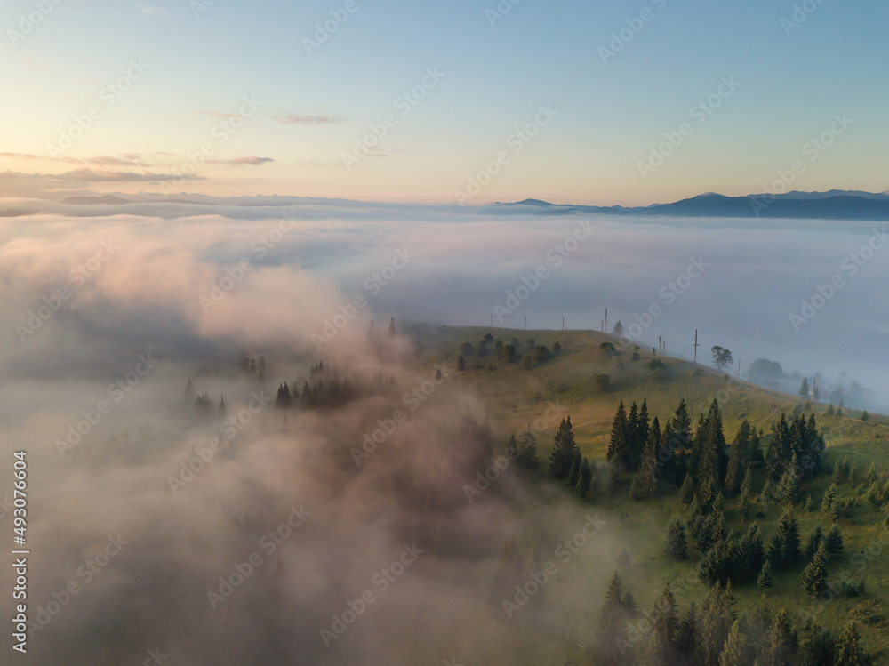 Foggy summer morning in the Ukrainian Carpathians. Aerial drone view.