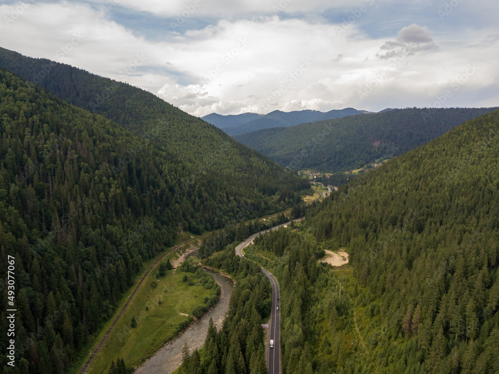 Green mountains of Ukrainian Carpathians in summer. Aerial drone view.