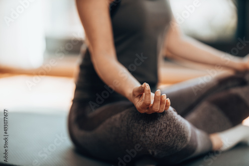Unrecognizable Woman Practicing A Yoga Routine At Home