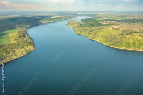 Magnificent aerial view on small tributary of the Dniester River with picturesque shores. National Nature Park Podilski Tovtry, the Dniester River, Ukraine. Beautiful view from flying drone.