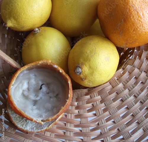 original candle from manadrin in a wicker basket