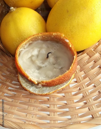 original candle from manadrin in a wicker basket