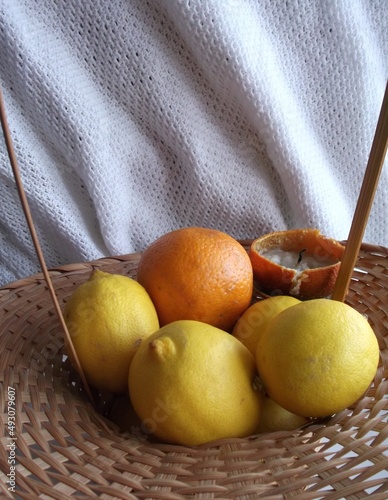 citrus candle in a wicker basket, unusual candlestick