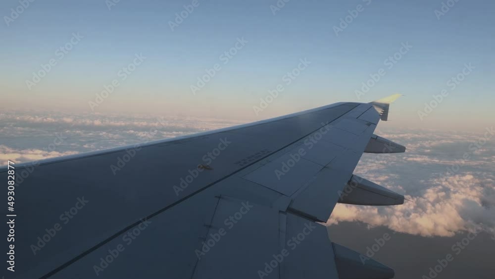 Airplane's wing, cloudy sky, flying high with airplane, beautiful sky view from airplane 4K video Airplane's wing, cloudy sky, flying high with airplane, beautiful sky view from airplane 4K video