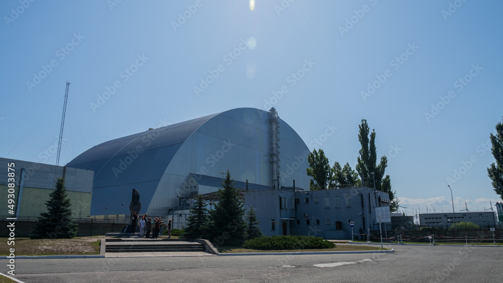 The fourth reactor of the Chernobyl nuclear power plant under a new safe sarcophagus. Exclusion Zone on a summer sunny day