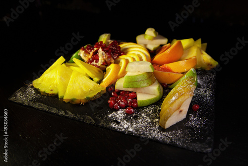 Assorted fruit on a black background