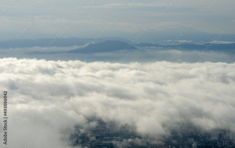 Aerial view above cloud of town