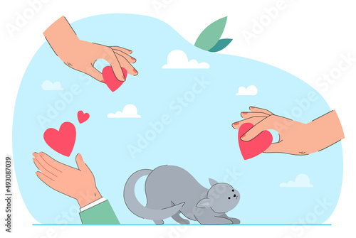 Homeless cat looking at giant hand holding heart. Hands of people giving love to kitten flat vector illustration. Animal care, protection concept for banner, website design or landing web page