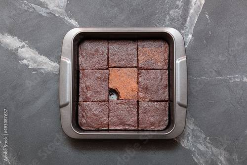 Slices of brownie dessert on a dark background

