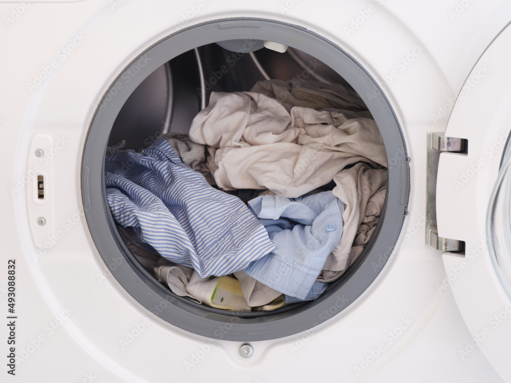 Dirty laundry inside a washing machine Dirty laundry inside a washing machine