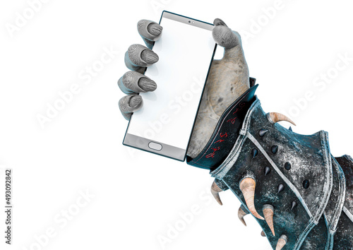 Fotografie, Obraz hand of a green orc holding a cell phone in a white background