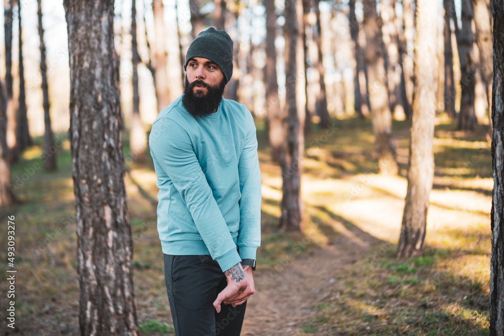 Man with beard enjoys exercising in nature. Man with beard enjoys exercising in nature.