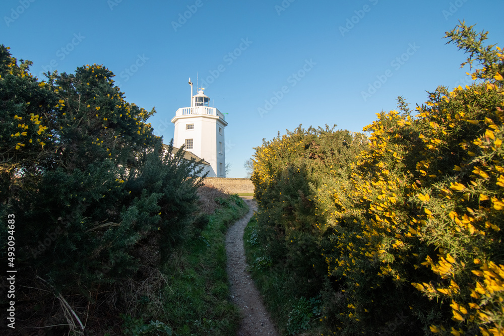 Cromer lighthouse in north Norfolk, UK. No longer in use and now a holiday let. Photographed in March 2022.