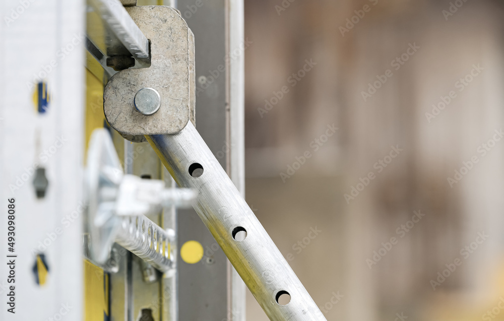 Construction details. Building the resistance poles of a residential flat construction. Details of the metal from the concrete. Construction industry. Construction details. Building the resistance poles of a residential flat construction. Details of the metal from the concrete. Construction industry.