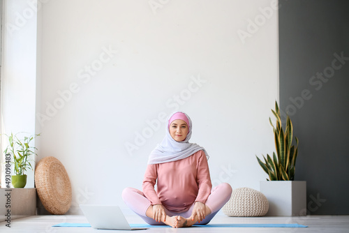 Young pregnant Muslim woman...