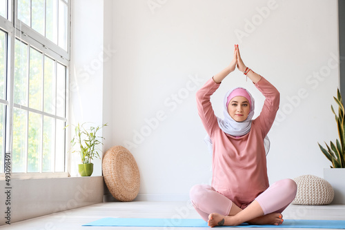 Young pregnant Muslim woman...